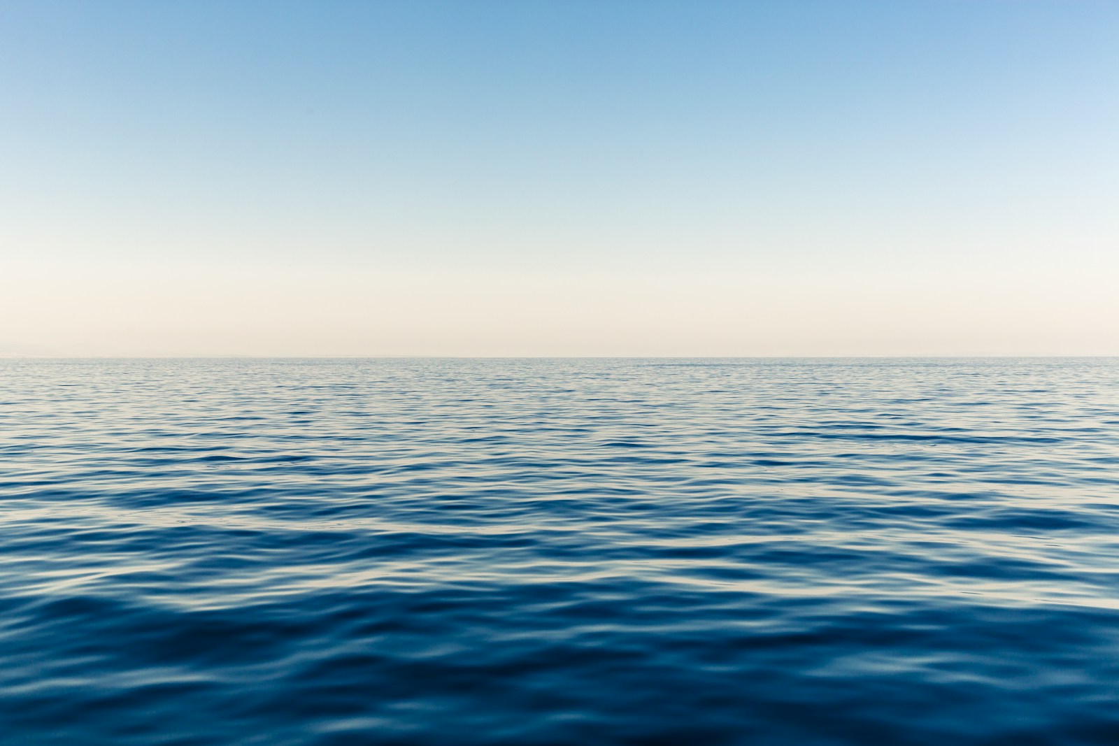 Photo by yucar studios blue ocean water during daytime